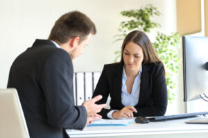 salesperson explaining to sales manager why not achieving sales targets